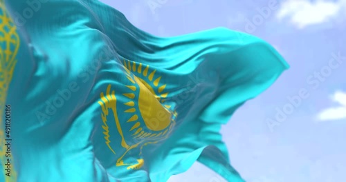 Detail of the national flag of Kazakhstan waving in the wind on a clear day. photo