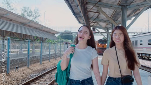 Young Asian happy woman lesbian Lgbt couples walking while sightseeing on holiday travel. Asian young lesbian Lgbt relationship and travel concept for stock footage.
