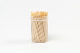 Toothpicks in a cylindrical box isolated on white background, too much dental pick, box of toothpicks, front view, selective focus
