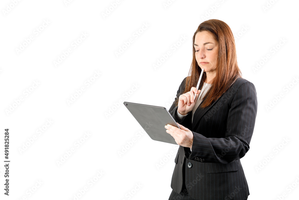 Business manager woman using a tablet. wearing a suit, smiling looking at camera. with Isolated on white background. 40-45 years old woman. Business manager woman using a tablet. wearing a suit, smiling looking at camera. with Isolated on white background. 40-45 years old woman.