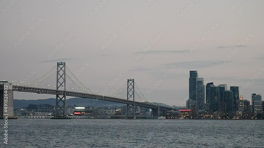 Panoramic sunset view of cityscape and bridge, San Francisco Panoramic sunset view of cityscape and bridge, San Francisco
