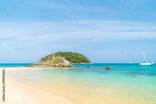 Fototapeta Naklejka Na Ścianę i Meble -  Yanui Beach with crystal clear water and island, near Promthep Cape, famous tourist destination and resort area, Phuket, Thailand