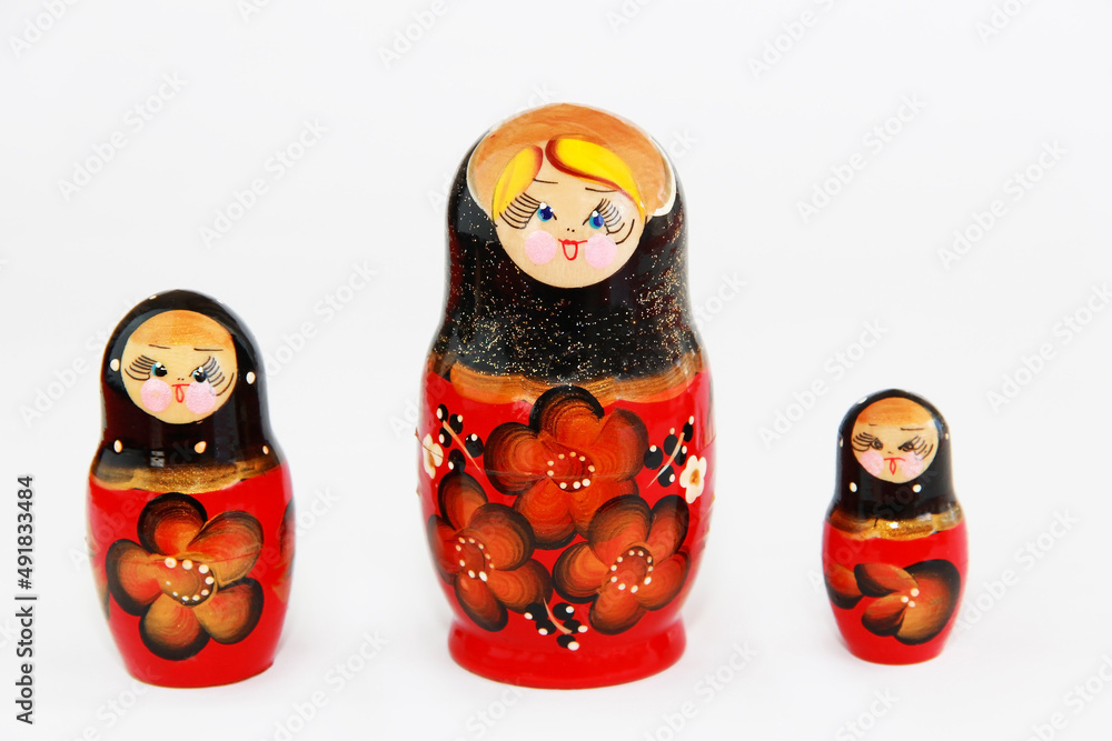 traditional Russian toy matryoshka doll with a floral pattern on a white background traditional Russian toy matryoshka doll with a floral pattern on a white background