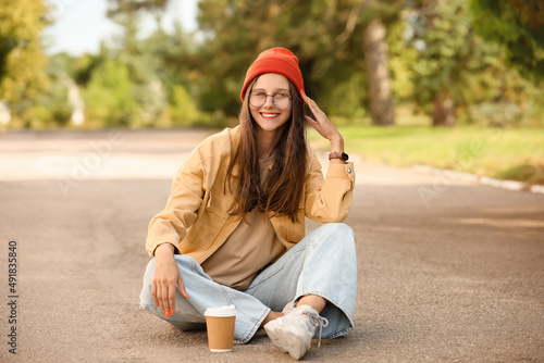 Cool young girl with cup of...