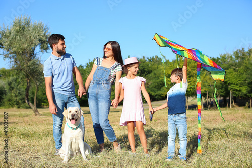 Happy family with cute dog ...