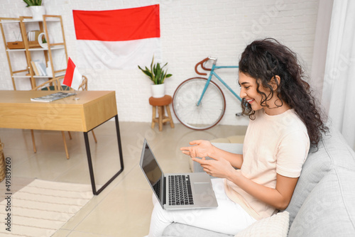 Asian woman using modern la...