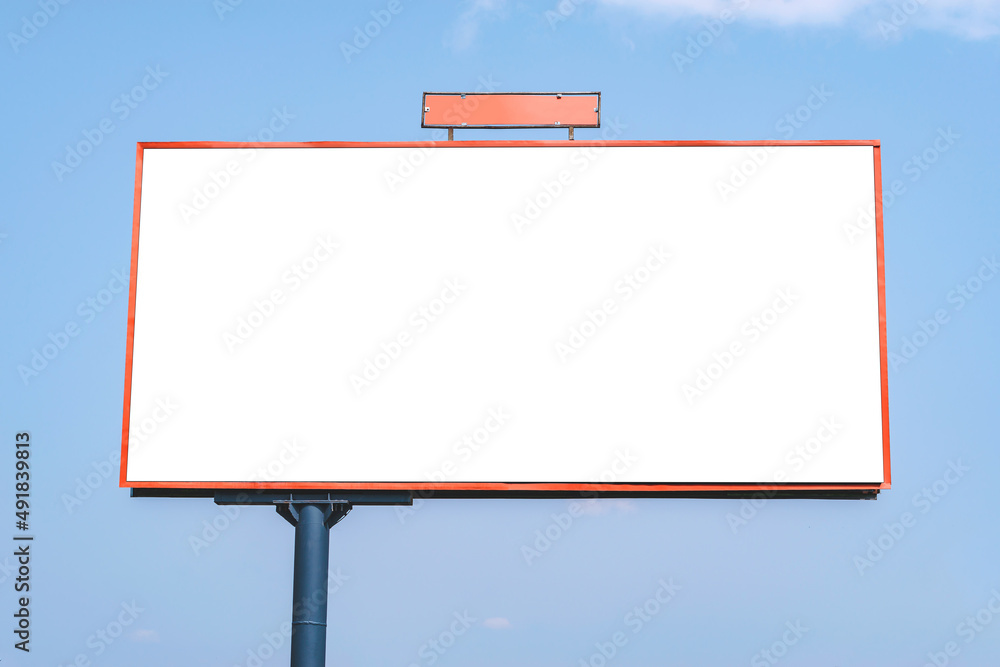 Blank white billboard mockup with red color clipping path. Against the background of the blue sky.