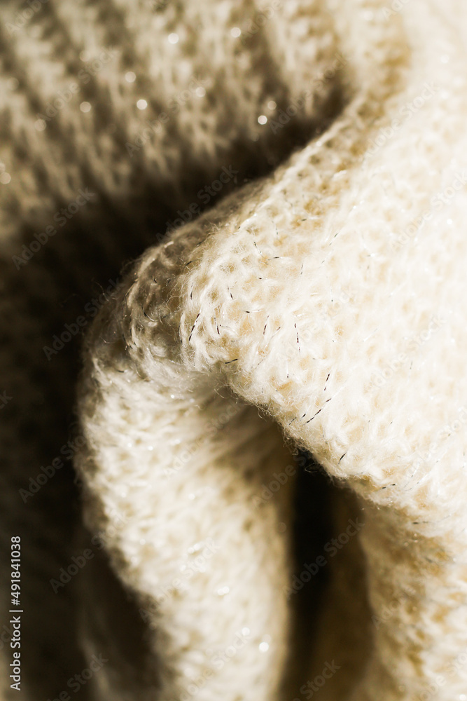 Texture of natural warm knitted fabric pattern white color. Texture of natural warm knitted fabric pattern white color.