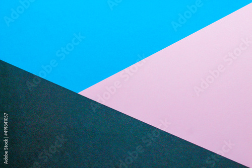 Abstract background with colored paper blue with pink color.