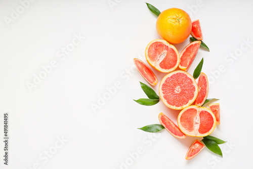 Fototapeta Naklejka Na Ścianę i Meble -  Fresh grapefruit pieces on white background