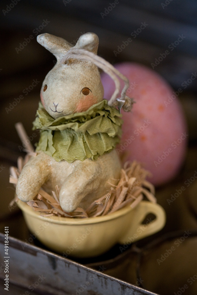 Easter Bunny decoration with egg -- – abstract, macro, close-up, image focus technique, full frame, antique, pastel, holiday background 
