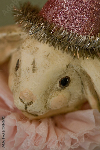 Easter Bunny decoration  antique with pink party hat -- abstract, macro, close-up, image focus technique, full frame, antique, pink pastel, holiday, birthday, party background 