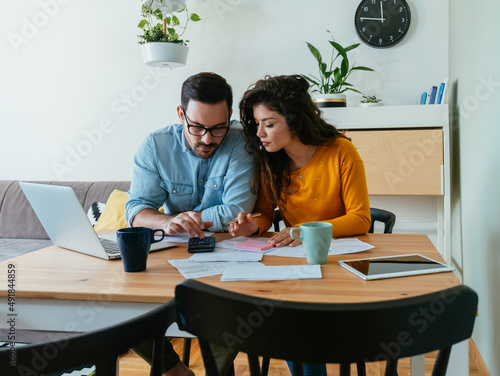 Φωτογραφία Serious Couple Paying Bills at Home