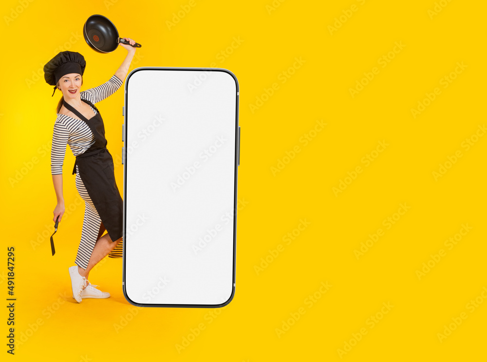 Restaurant mobile app. Cook is dancing near giant phone. Mockup of giant phone on yellow. Template for showcasing restaurant app. Mockup for website design in smartphone. Promotional offer from chef