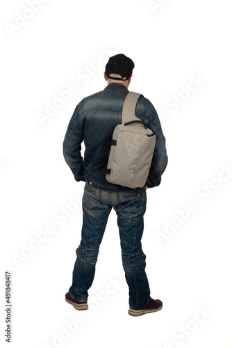 Human in denim suit. Man in full growth with backpack. Human in denim suit with back of camera. Guy in baseball cap and sneakers isolated on white. Mature man hands in trousers pockets