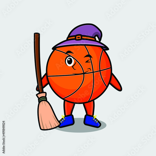 Cute cartoon witch shaped basketball character with hat and broomstick  photo
