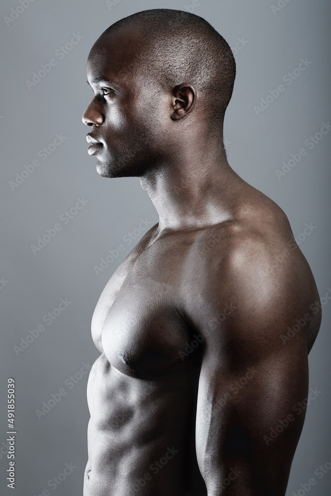 Pure masculinity. Studio shot of a bare-chested african american man. Pure masculinity. Studio shot of a bare-chested african american man.