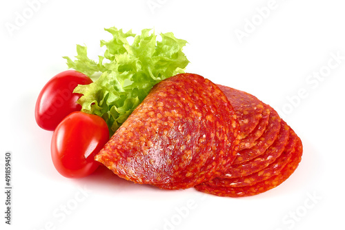 Spanish pork chorizo sausage slices, close-up, isolated on white background.