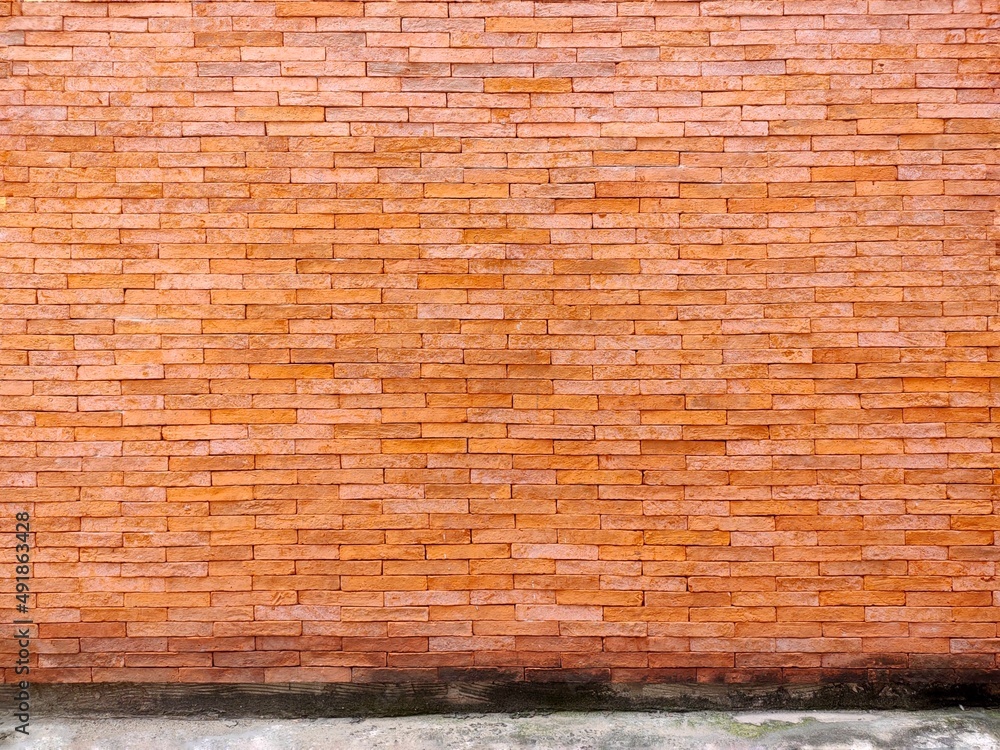 Fototapeta premium brick wall as a background or texture. an example of masonry as a cladding of external walls.