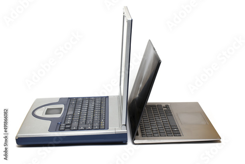 comparison generations old modern laptops white background