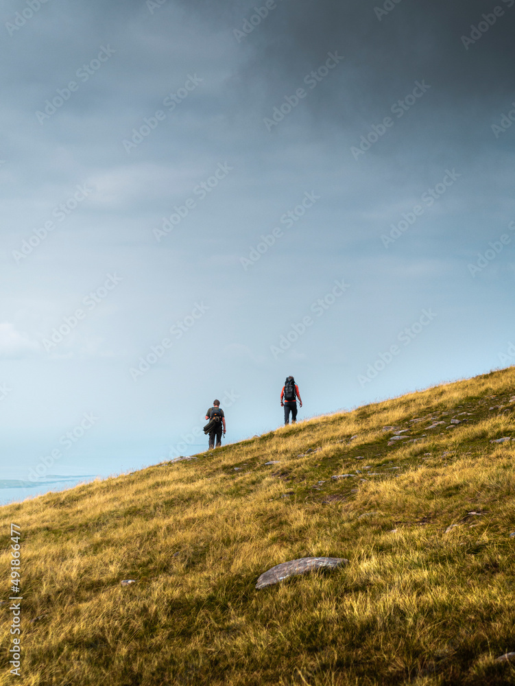 Two men hiking outdoors in moutains