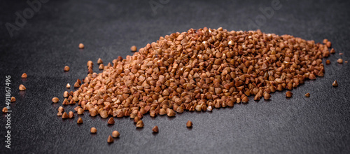 Bio buckwheat cereals raw food background, texture close up © chernikovatv