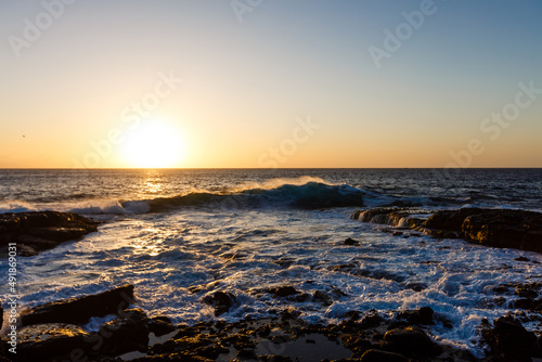 quiet sea coast with stones at the twilight, natural sea background