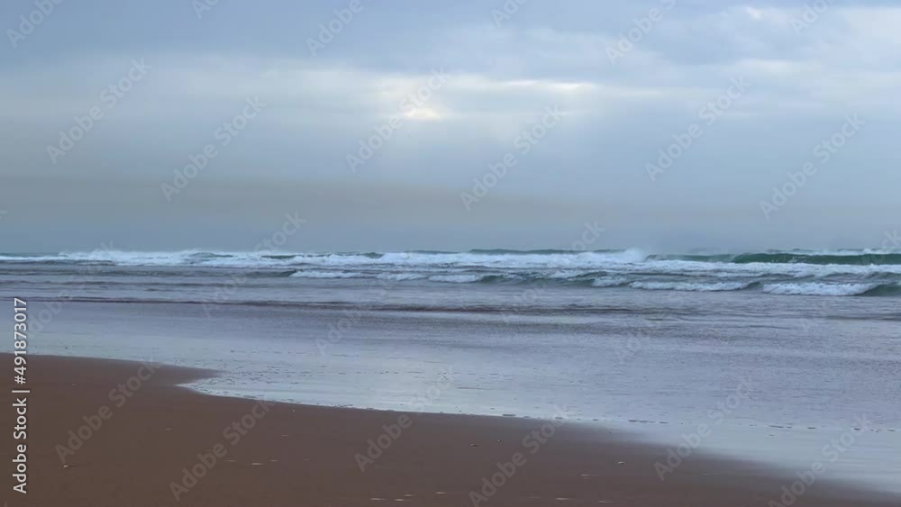 Sea waves crashing into the beach Sea waves crashing into the beach