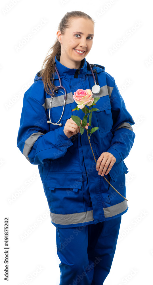 woman in medical uniform and a stethoscope. doctor, paramedic, nurse smiles, looks at us. An ambulance worker holds a rose and points a finger at the flower. White background woman in medical uniform and a stethoscope. doctor, paramedic, nurse smiles, looks at us. An ambulance worker holds a rose and points a finger at the flower. White background