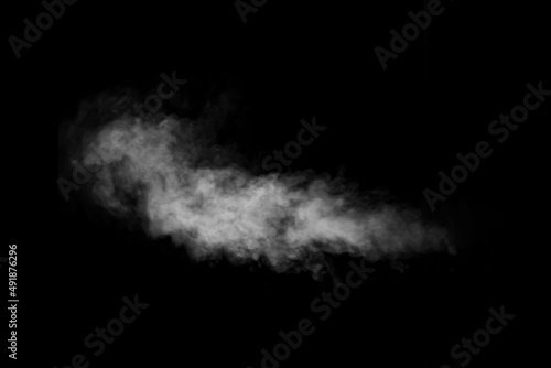 Swirling, wriggling smoke, steam, isolated on a black background for overlaying on your photos. Fragment of vertical steam. Abstract smoky background, design element