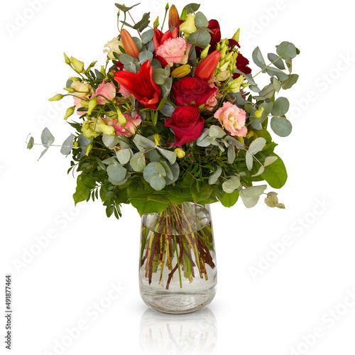 bouquet of flowers in a glass vase isolated on white background with clipping path