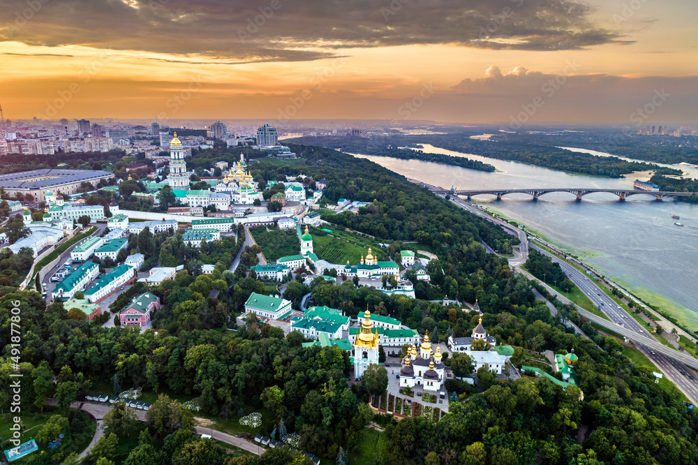 Sunset above Kiev Pechersk Lavra and the Dnieper River in Kyiv before the war with Russia. UNESCO world heritage in Ukraine