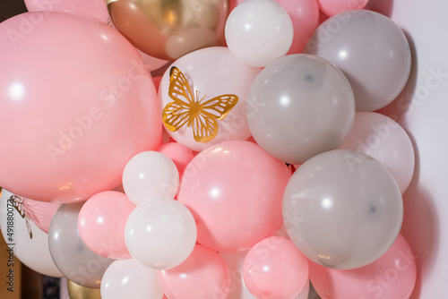 Photo zone with pink balloons and golden butterfly