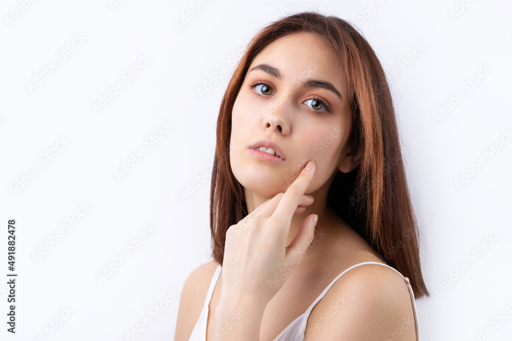 Beautiful smiling woman with clean skin, natural make-up and white teeth on a gray background Beautiful smiling woman with clean skin, natural make-up and white teeth on a gray background
