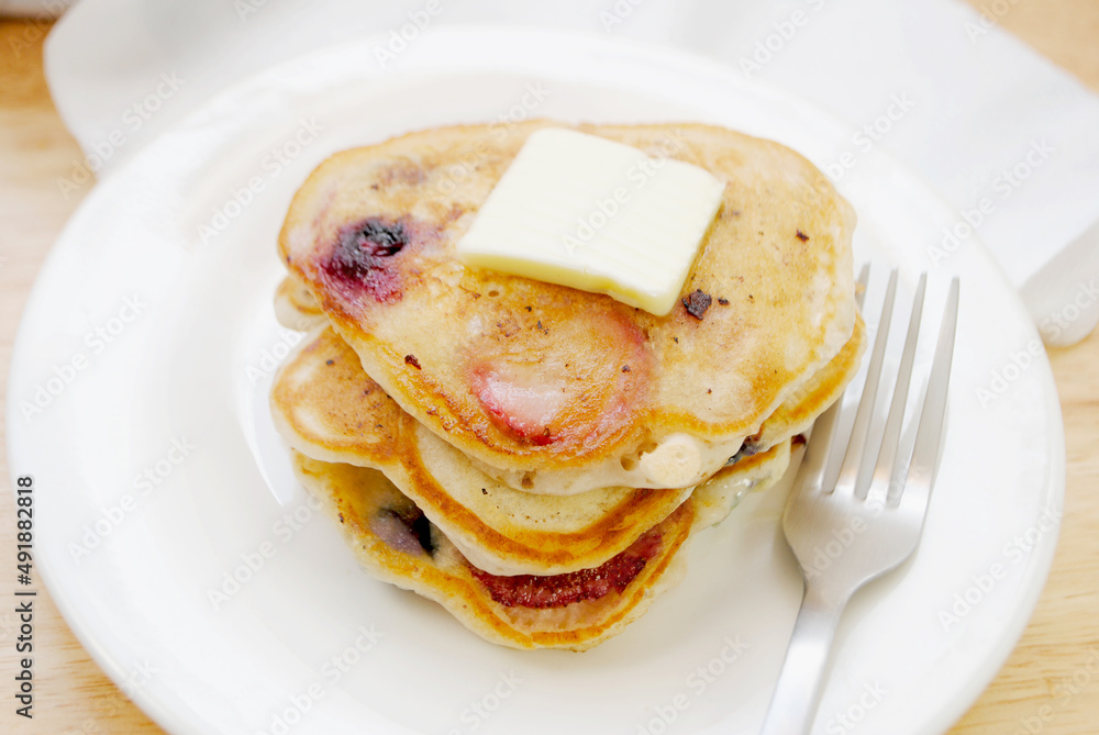 Healthy Strawberry and Blueberry Pancakes Served with Butter