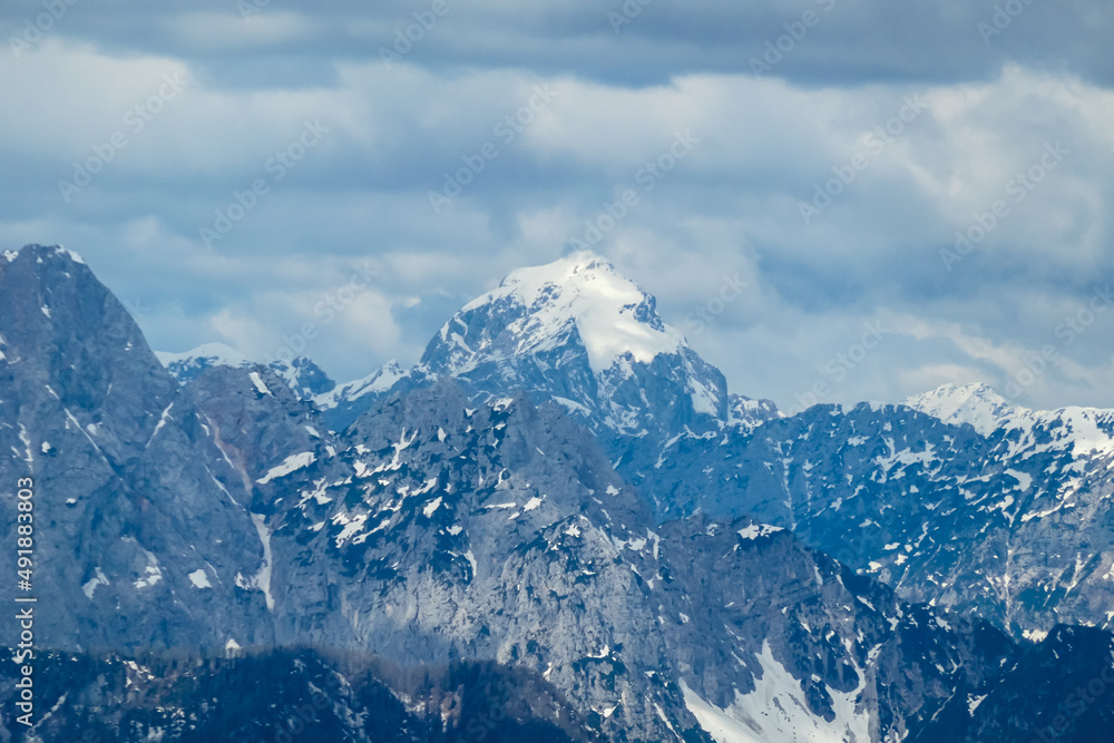 Panoramic view in spring from Frauenkogel on mount Mangart in the Julian Alps, Friuli, Italy. Border Austria, Italy, Slovenia. Triglav National Park. Upper Drava valley. Summit Panoramic view in spring from Frauenkogel on mount Mangart in the Julian Alps, Friuli, Italy. Border Austria, Italy, Slovenia. Triglav National Park. Upper Drava valley. Summit