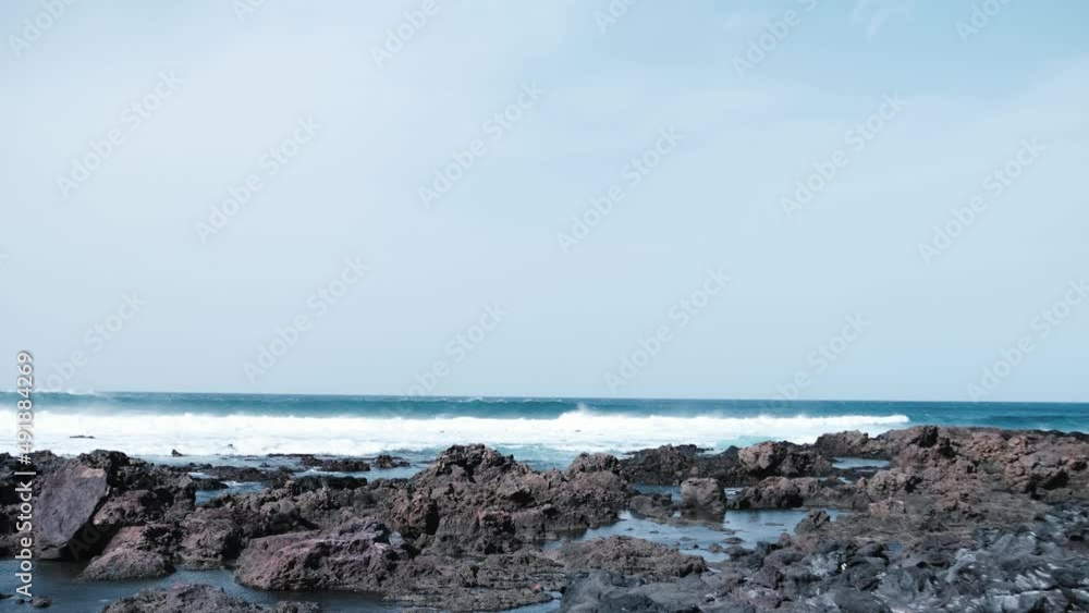 Awesome power waves breaking over dangerous rocks Awesome power waves breaking over dangerous rocks
