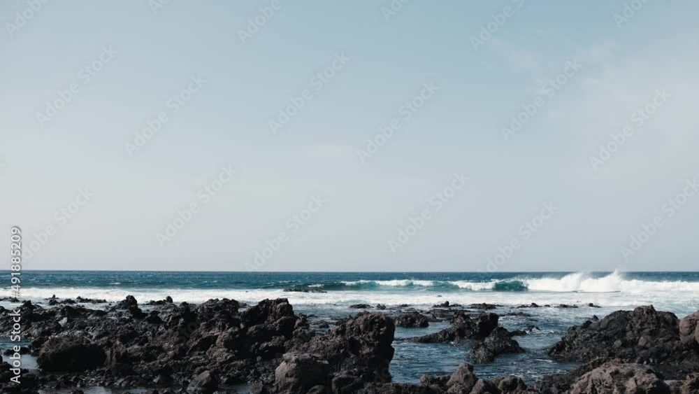Awesome power waves breaking over dangerous rocks
