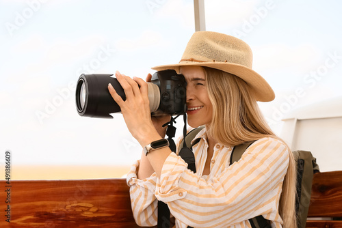 Beautiful female tourist wi...