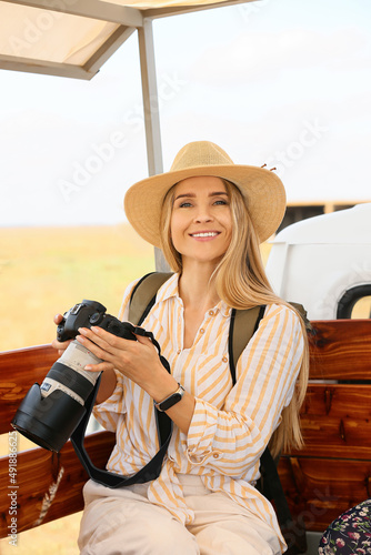 Beautiful female tourist wi...