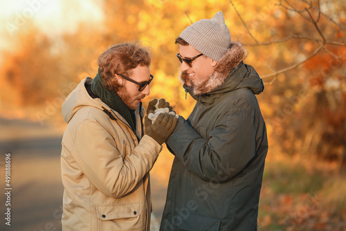 Happy gay couple in autumn ...