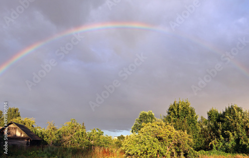 Rainbow on the background of gray clouds