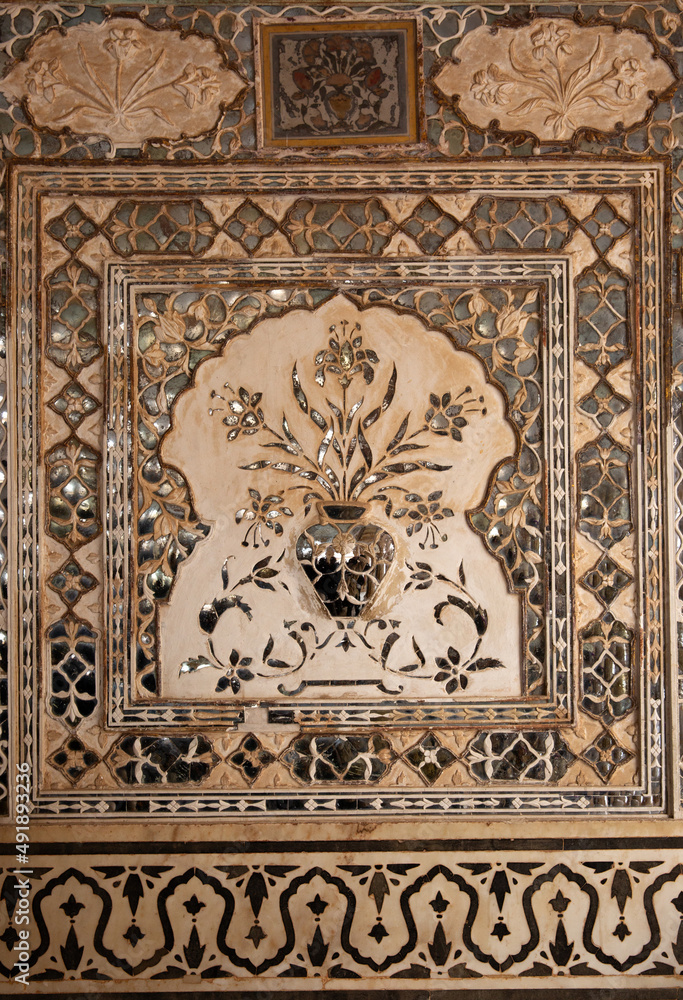 Intricate design and embedded mirrors in Sheesh Mahal of  ancient Amer fort of Jaipur, India