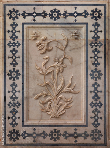 Designs on the wall of Sheesh Mahal of ancient Amer fort of Jaipur, India