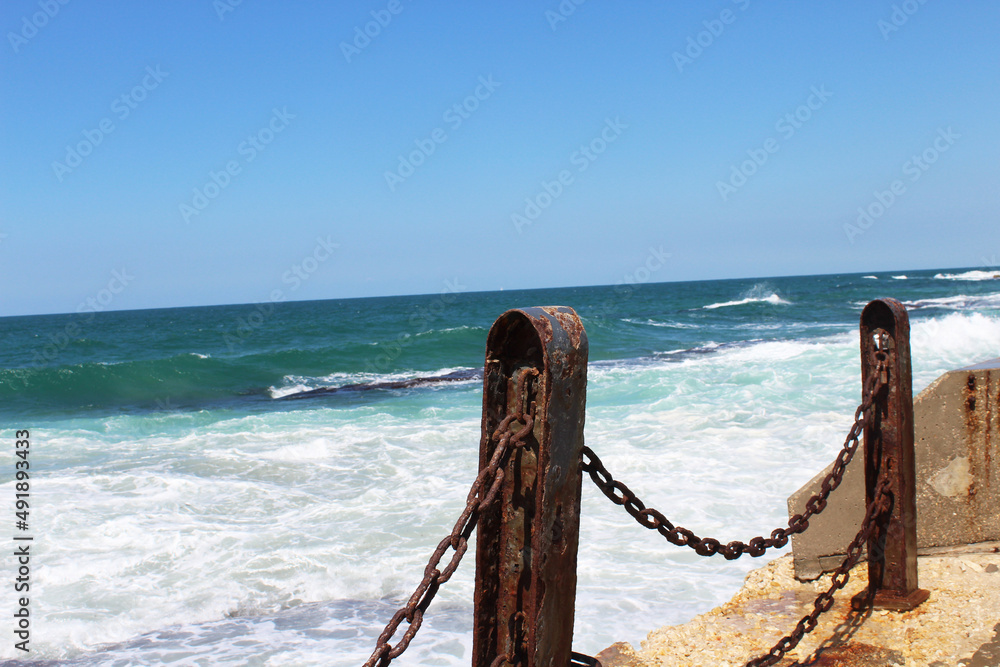 Obraz premium fence on the beach