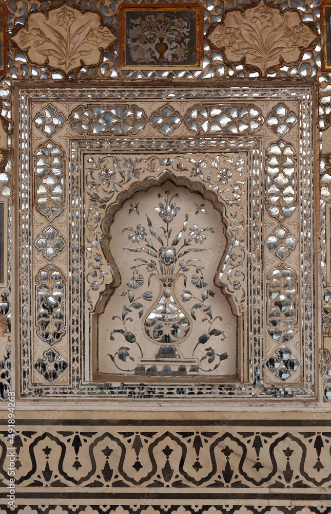 Intricate design and embedded mirrors inside Sheesh Mahal of  ancient Amer fort of Jaipur, India