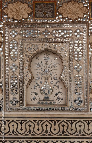 Intricate design and embedded mirrors inside Sheesh Mahal of ancient Amer fort of Jaipur, India