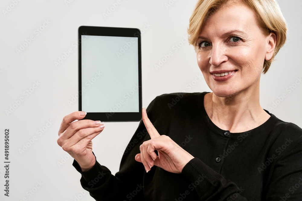 Cropped image of woman showing digital tablet