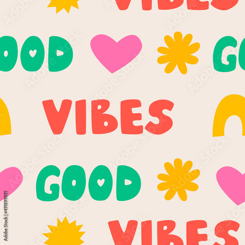 Seamless pattern with words good vibes, hearts, sun and rainbow. Simple colorful shapes. Cute hippie style. Vector background