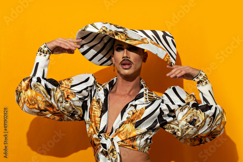 Portrait of Marvellous Drag Queen Diva with yellow background photo